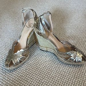 Brand new Catherine Malandrino gold wedge size 7